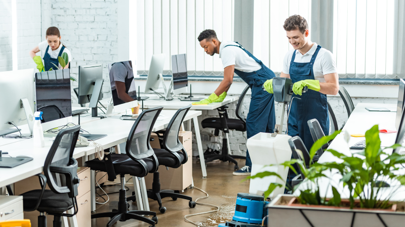 Day porter cleaning staff disinfecting office surfaces in Palm Beach