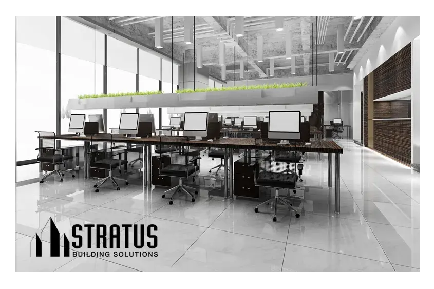 Large Office Interior with Clean White Hard Floors and Eight Computer Work Stations